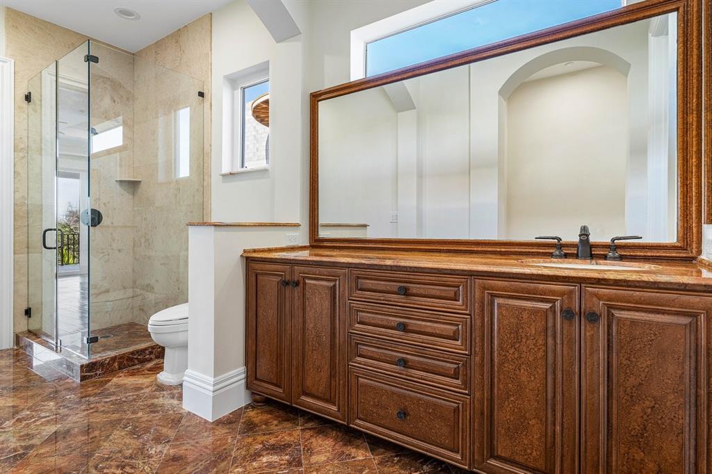 549 Northeast 19th Avenue, Unit C Deerfield Beach, FL 33441 - Photo 41 of 79 a bathroom with a sink a toilet and a mirror