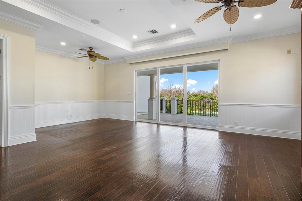 549 Northeast 19th Avenue, Unit C Deerfield Beach, FL 33441 - Photo 42 of 79 an empty room with wooden floor and windows