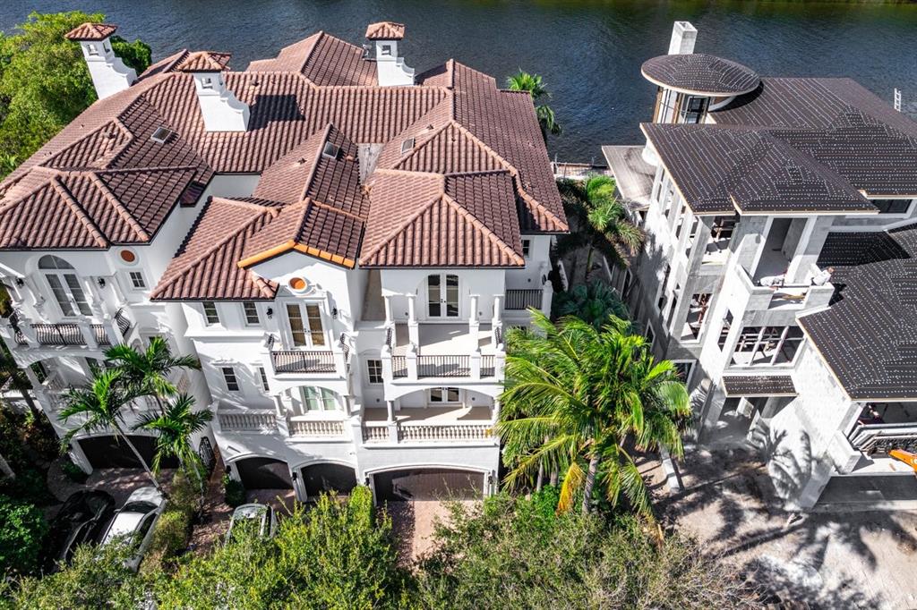 549 Northeast 19th Avenue, Unit C Deerfield Beach, FL 33441 - Photo 58 of 79 a front view of a house with garden