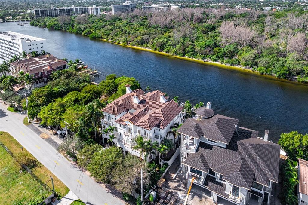549 Northeast 19th Avenue, Unit C Deerfield Beach, FL 33441 - Photo 60 of 79 an aerial view of a house with a yard and lake view