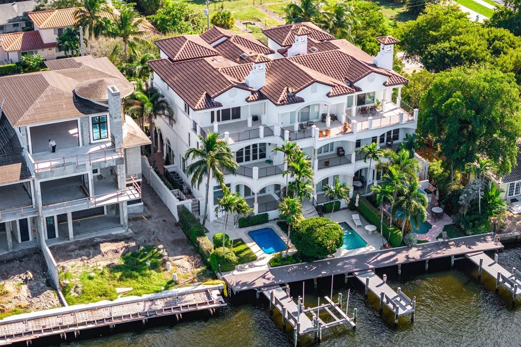 549 Northeast 19th Avenue, Unit C Deerfield Beach, FL 33441 - Photo 65 of 79 an aerial view of a house with a garden and lake view