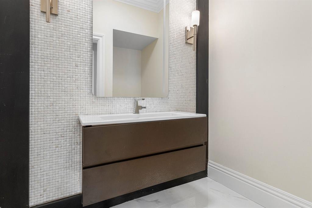 549 Northeast 19th Avenue, Unit C Deerfield Beach, FL 33441 - Photo 7 of 79 a bathroom with a sink and a mirror