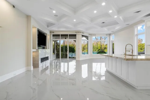 a kitchen with stainless steel appliances granite countertop a stove and a sink
