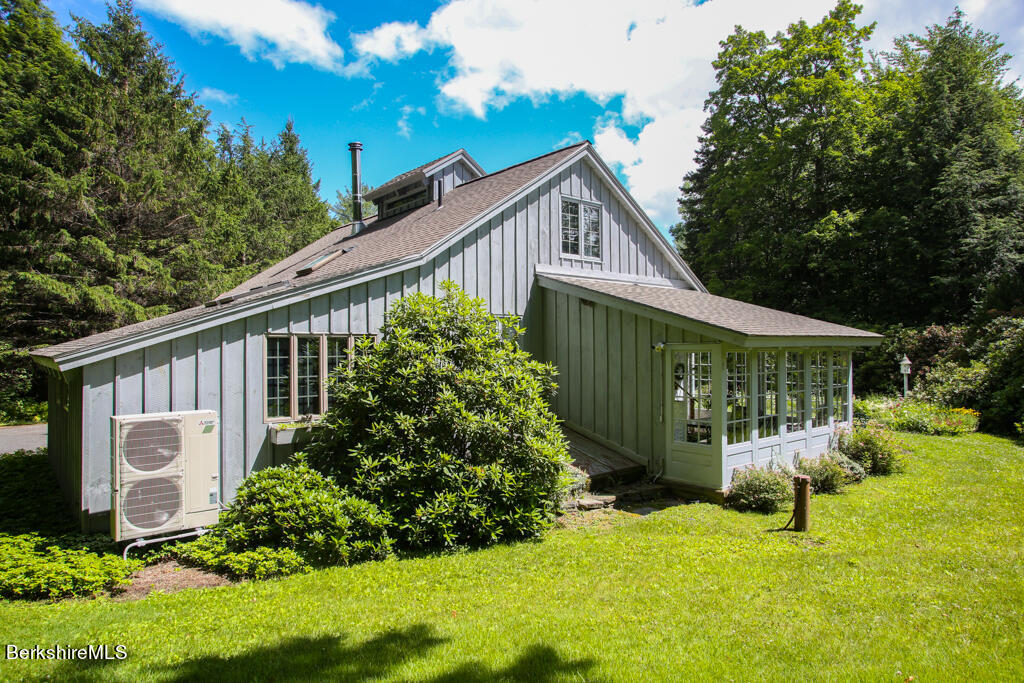 544 Tunnel Road Rowe, MA 01367 - Photo 5 of 32 a front view of a house with garden