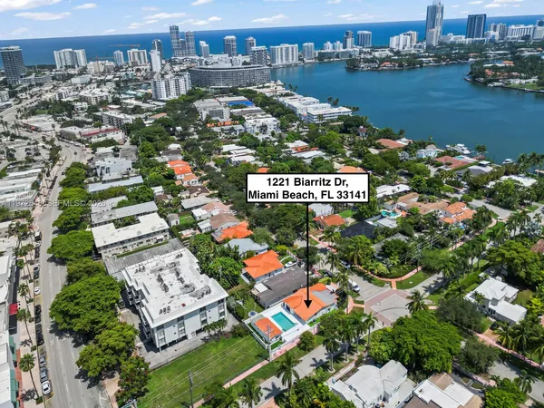an aerial view of a house with a lake view