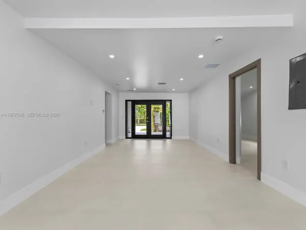 a view of an empty room with a window