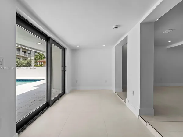 a view of hallway with windows