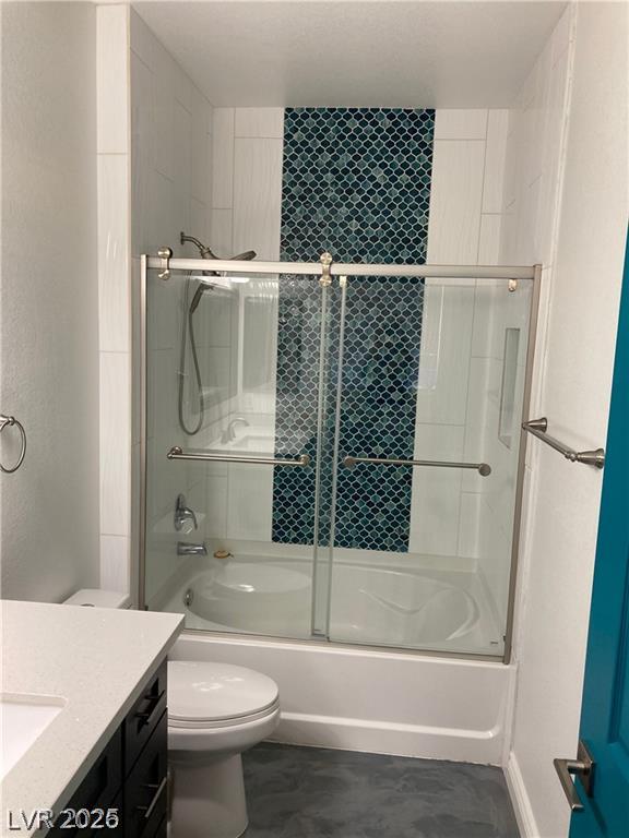 9050 West Warm Springs Road, Unit 1027 Las Vegas, NV 89148 - Photo 25 of 44 A well-appointed bathroom features a bathtub with sliding glass doors and distinctive tiled accent wall.