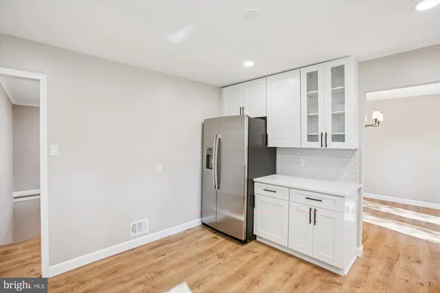 a view of a kitchen with a refrigerator a sink and dishwasher