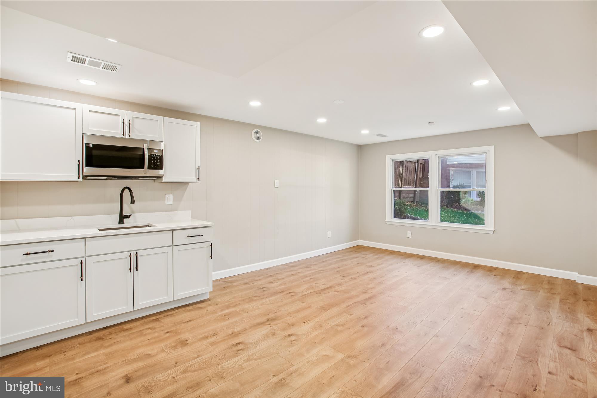 9075 Andromeda Drive Burke, VA 22015 - Photo 16 of 30 a view of kitchen with sink stainless steel appliances wooden floor and window