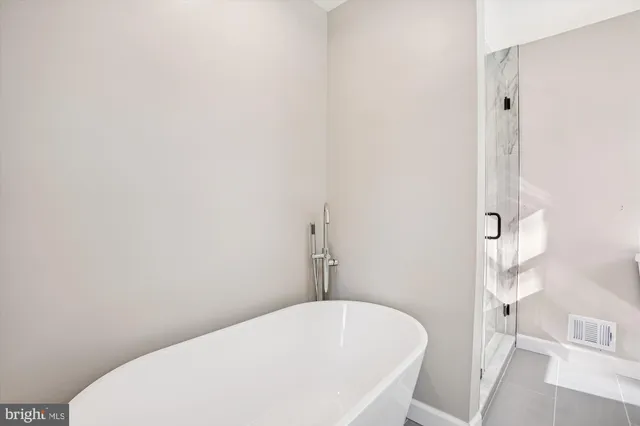 a bathroom with a white tub