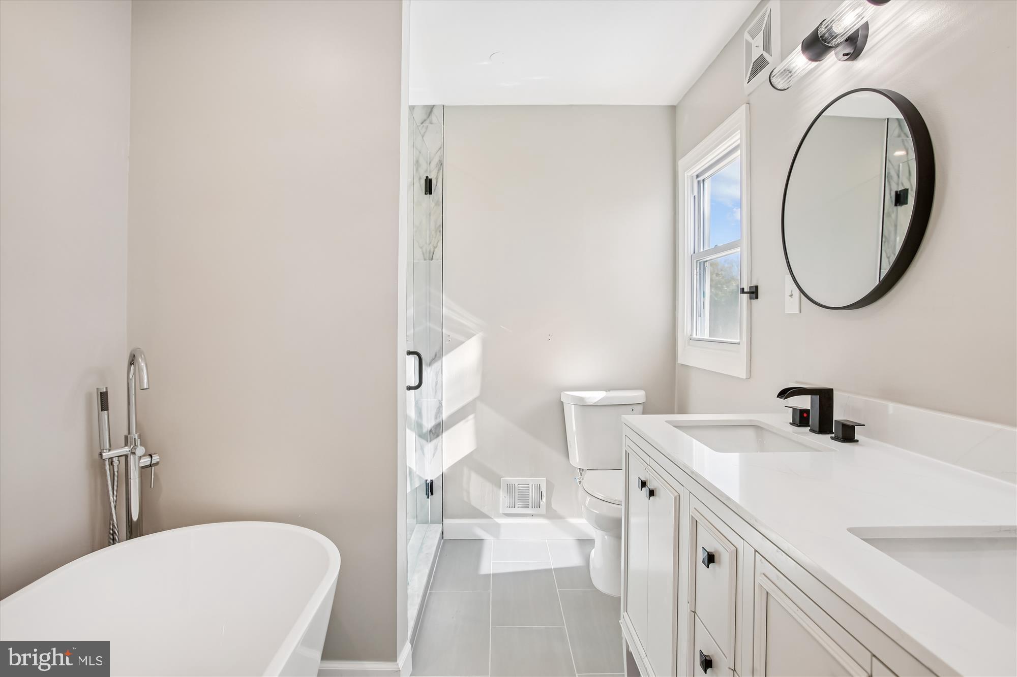 9075 Andromeda Drive Burke, VA 22015 - Photo 19 of 30 Modern bathroom with elegant fixtures.