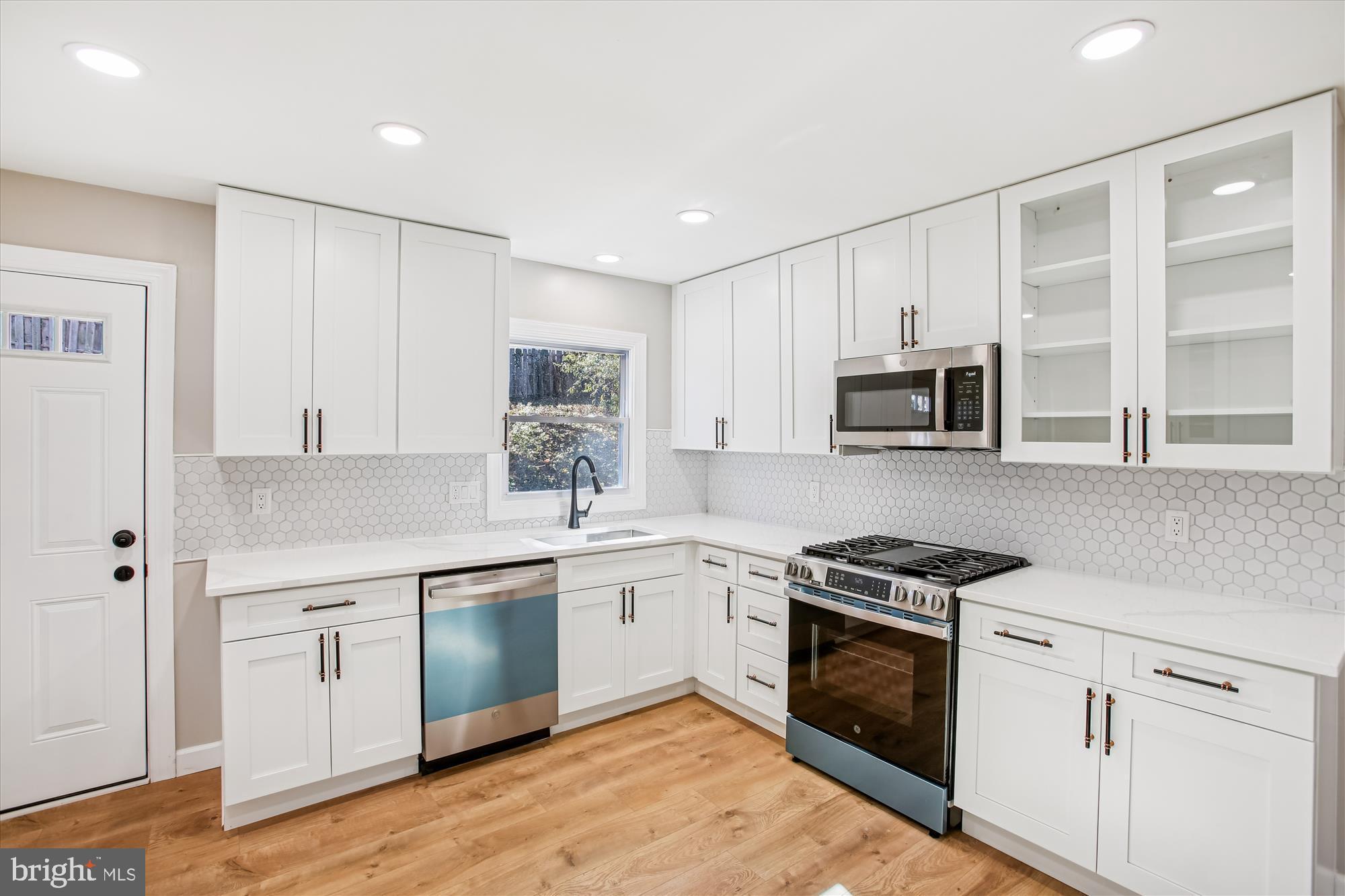 9075 Andromeda Drive Burke, VA 22015 - Photo 2 of 30 Modern kitchen with sleek finishes.