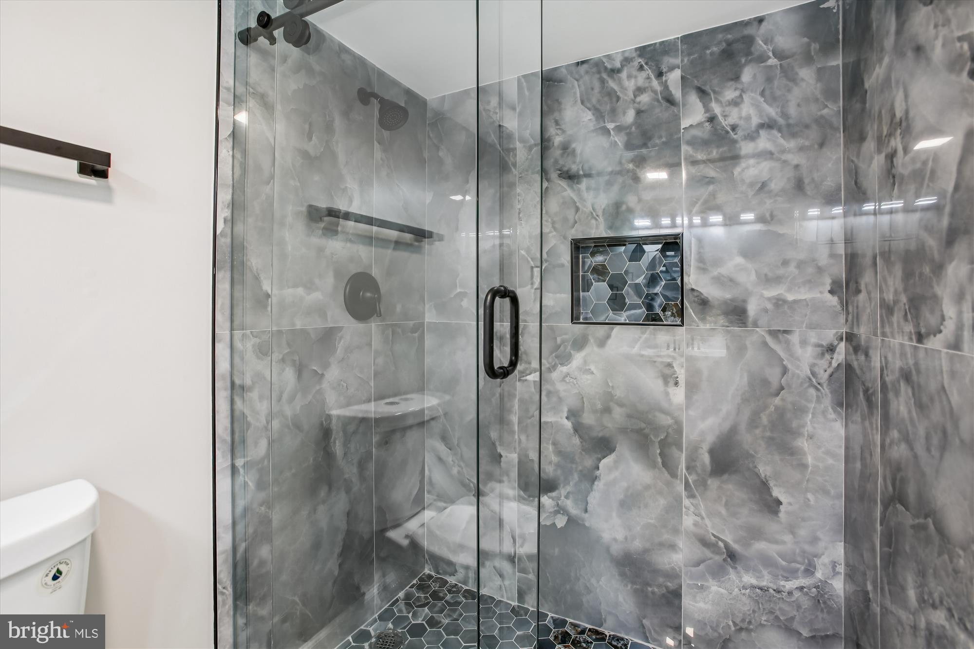 9075 Andromeda Drive Burke, VA 22015 - Photo 24 of 30 a bathroom with a shower