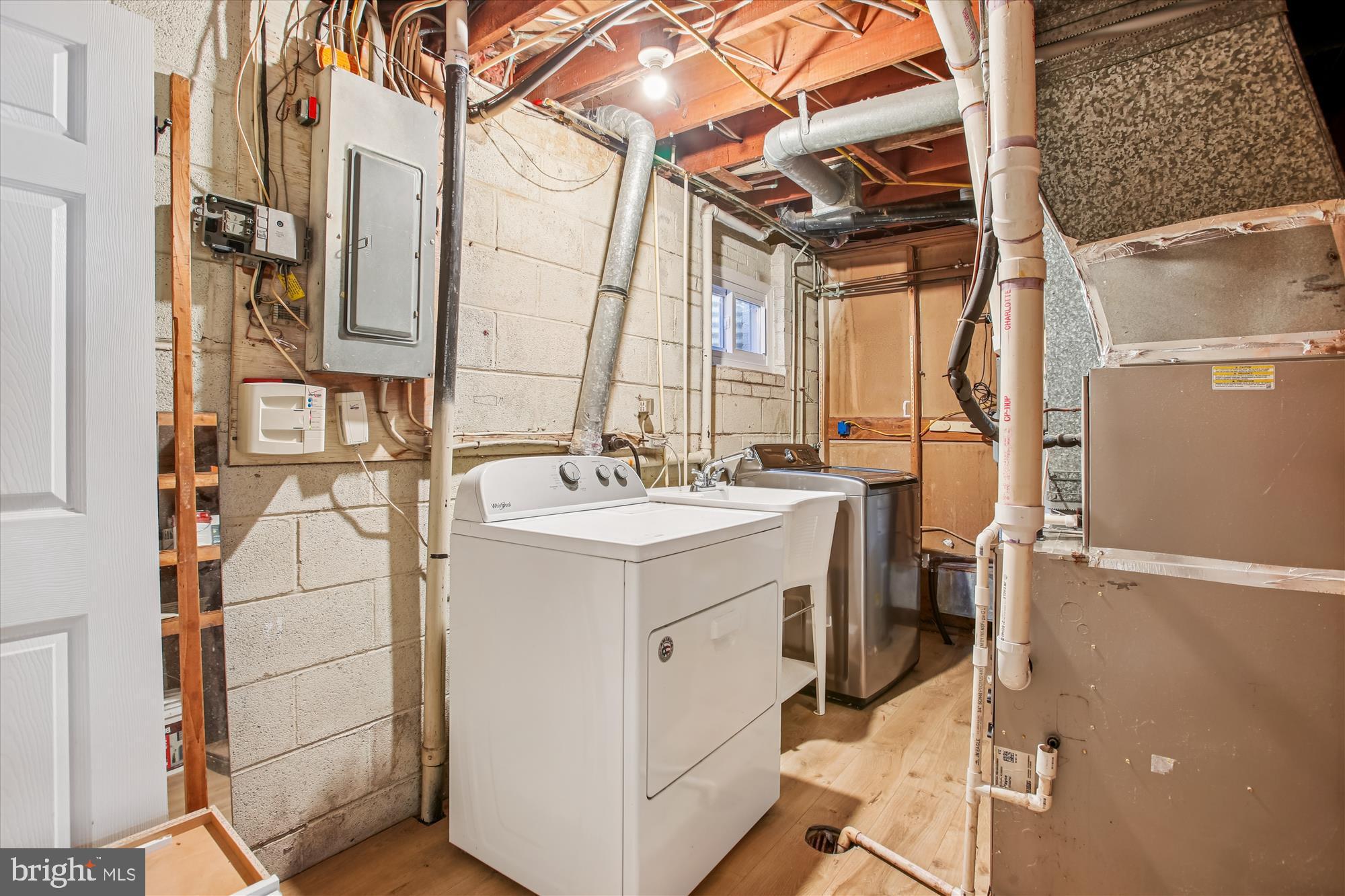 9075 Andromeda Drive Burke, VA 22015 - Photo 26 of 30 Functional laundry space with utility features.