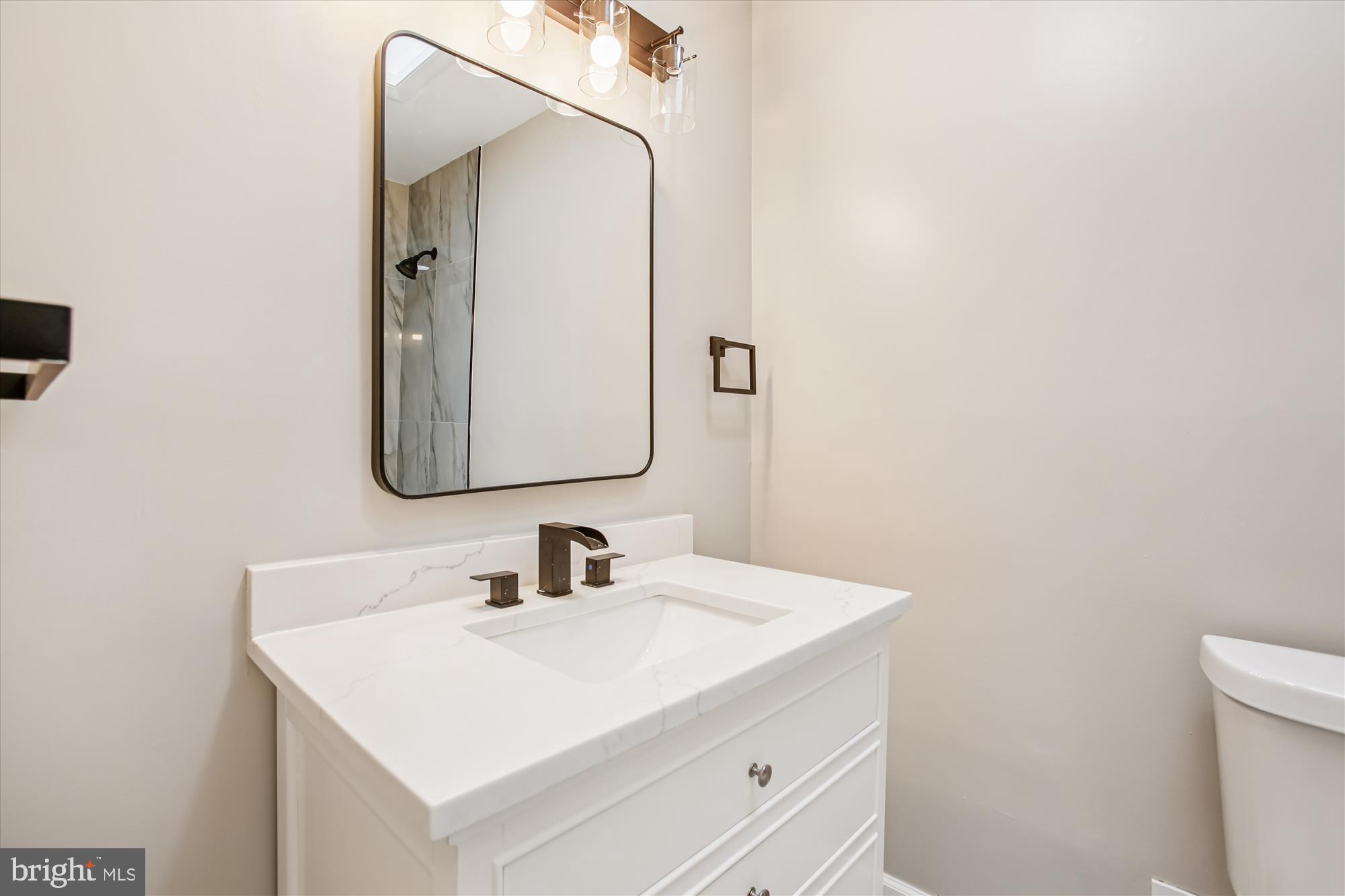 9075 Andromeda Drive Burke, VA 22015 - Photo 7 of 30 a bathroom with a sink and a mirror