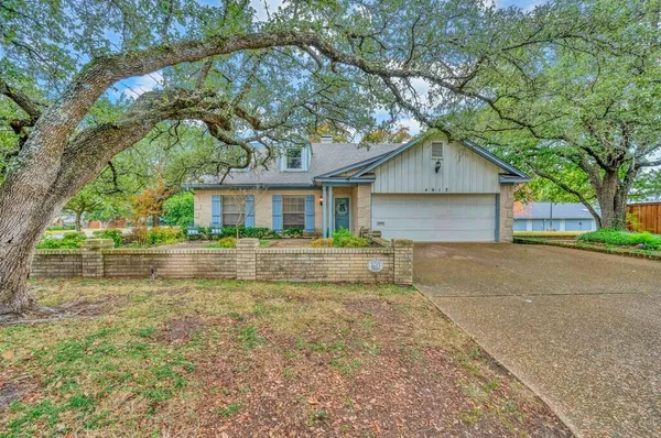 a house with trees in the background