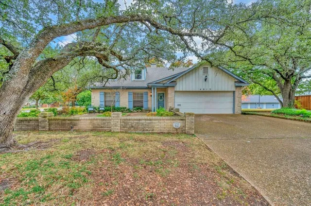 a house with trees in the background