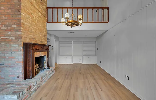 a view of a livingroom with wooden floor