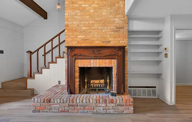 a view of fireplace and stairs