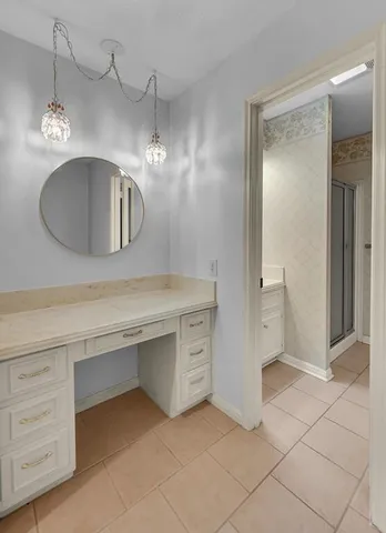 a bathroom with a sink a vanity and a mirror