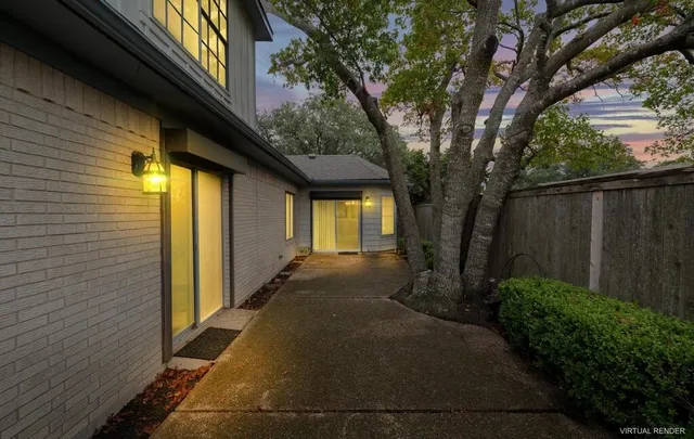 a view of a house with a large trees