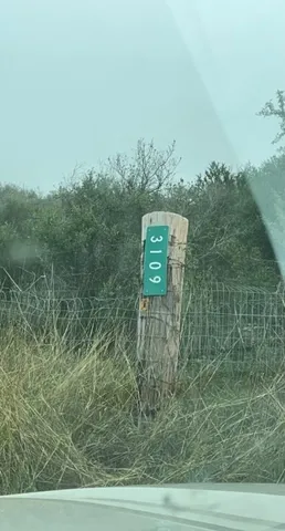 a view of a bench in a field