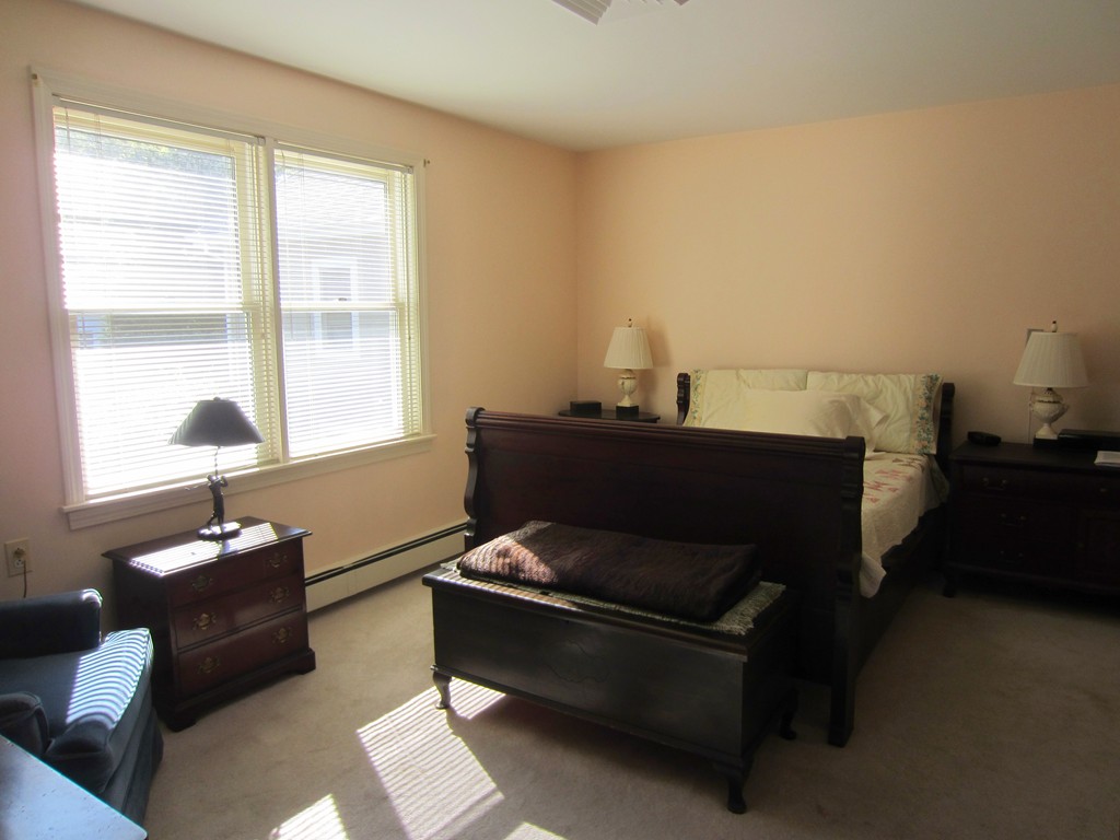 140 Lincoln Road, Unit 216 Lincoln, MA 01773 - Photo 5 of 7 a living room with furniture and a window