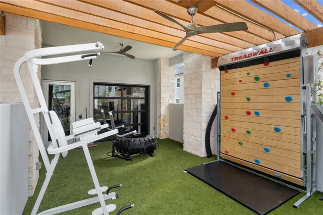 a room with pool table and chairs