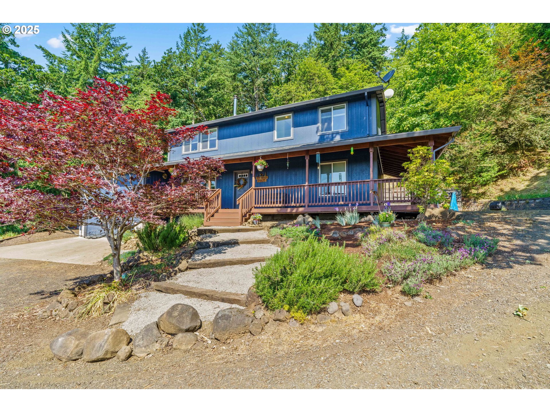 34637 Knox Butte Road East Albany, OR 97322 - Photo 1 of 47 a view of a wooden house with a yard and potted plants