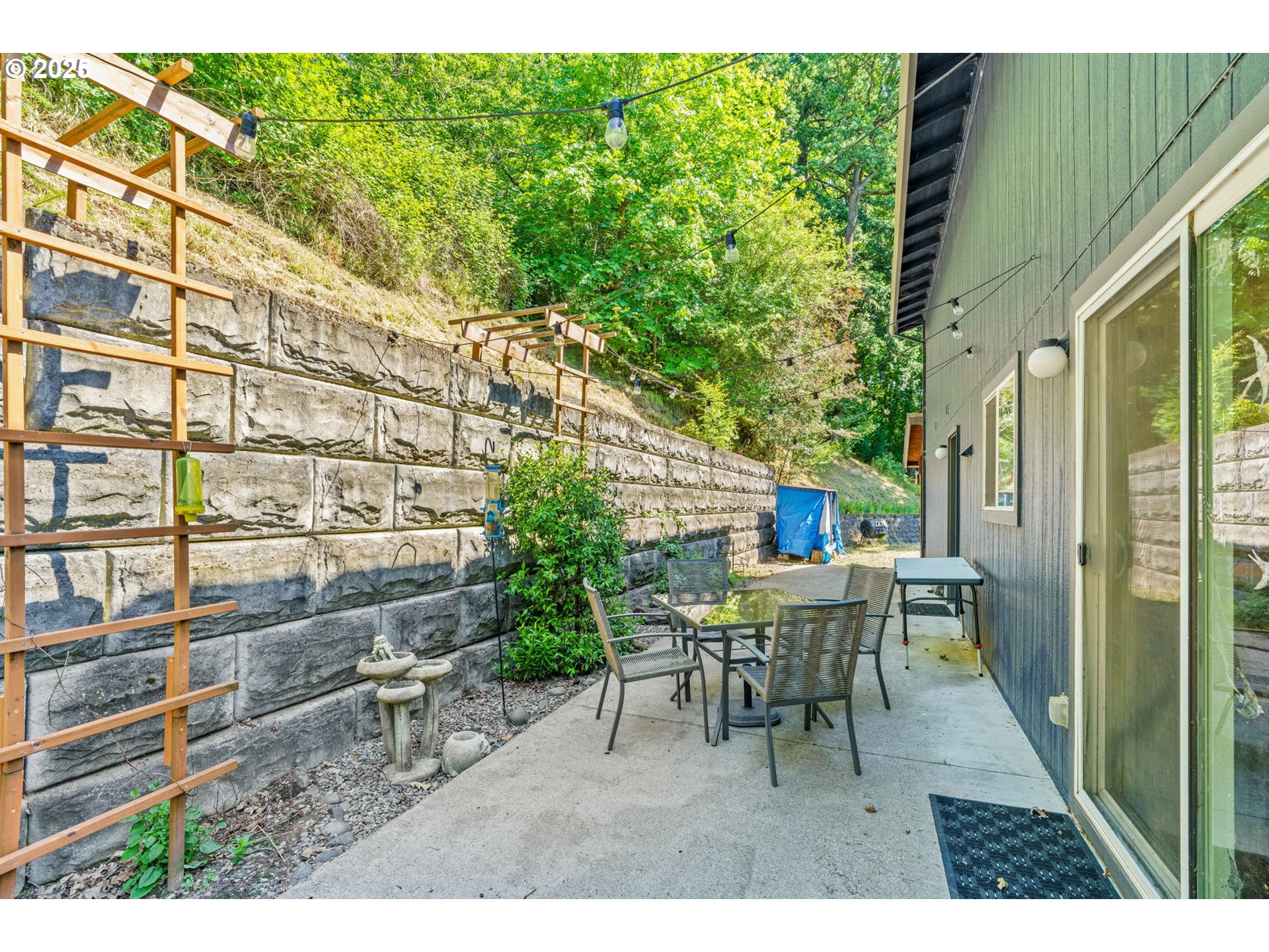 34637 Knox Butte Road East Albany, OR 97322 - Photo 28 of 47 a balcony with table and chairs and potted plants