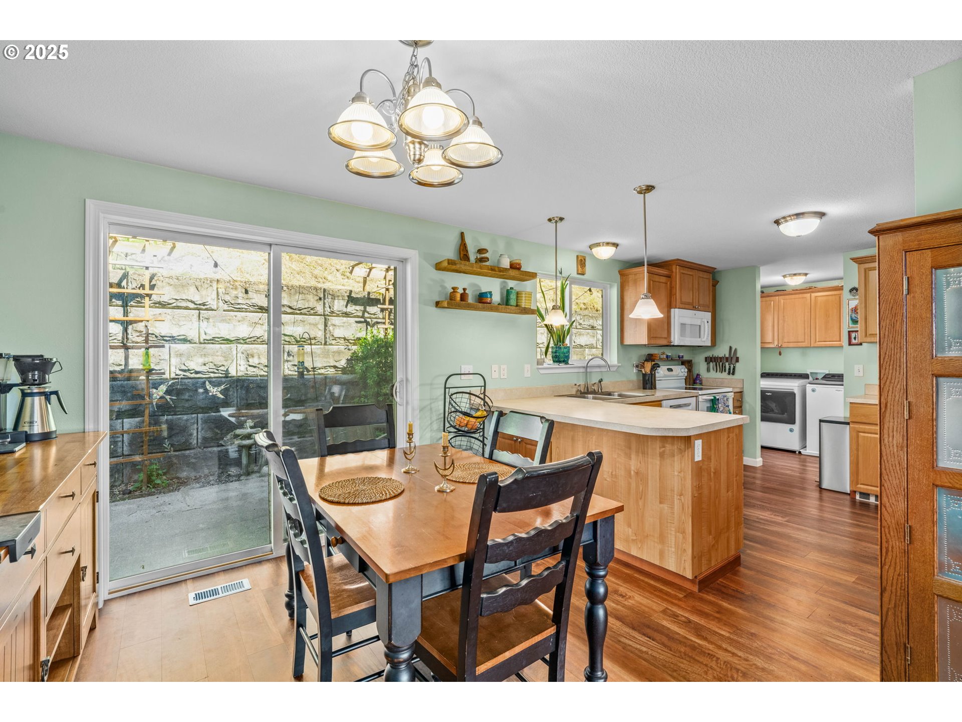 34637 Knox Butte Road East Albany, OR 97322 - Photo 9 of 47 a view of a dining room with furniture wooden floor and chandelier