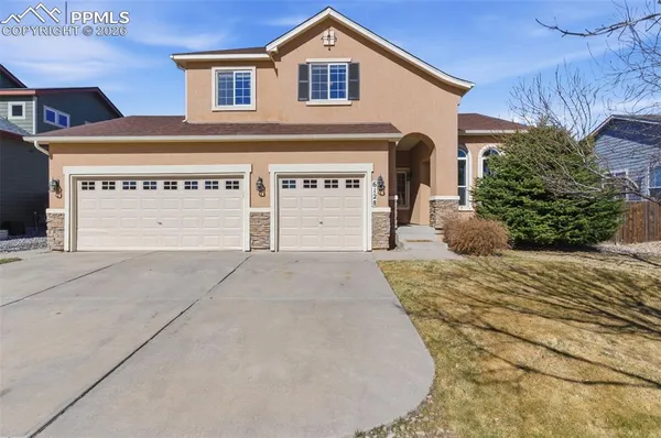 a front view of a house with a garage