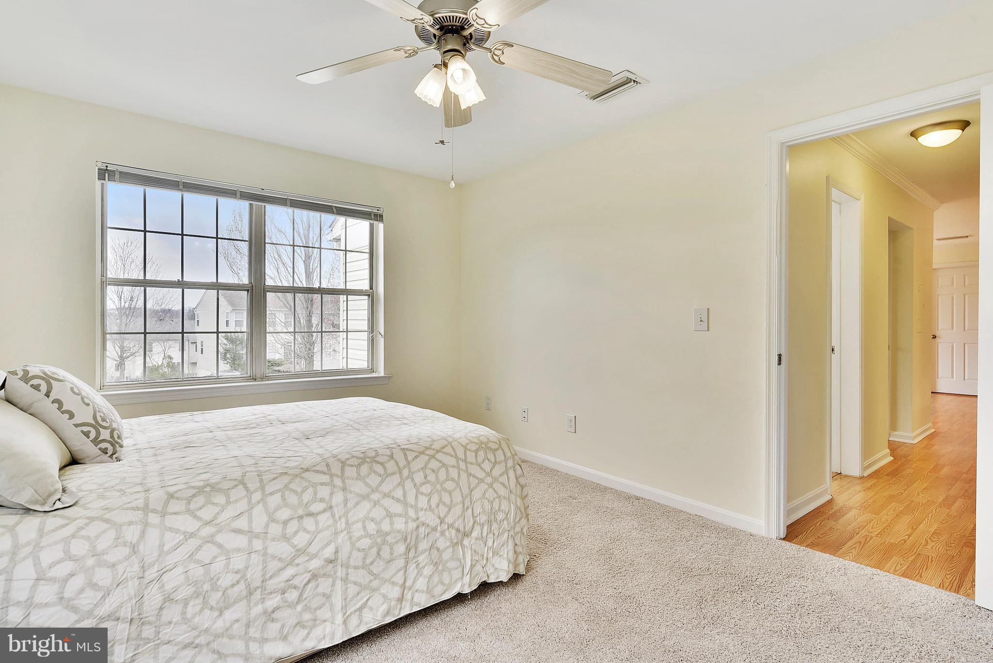 14802 Rydell Road, Unit 202 Centreville, VA 20121 - Photo 12 of 27 a bedroom with a bed and a window