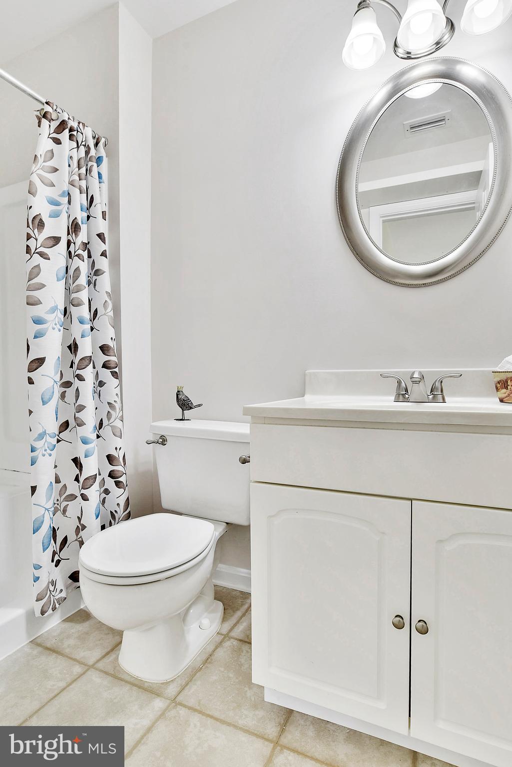 14802 Rydell Road, Unit 202 Centreville, VA 20121 - Photo 14 of 27 a bathroom with a toilet and a mirror