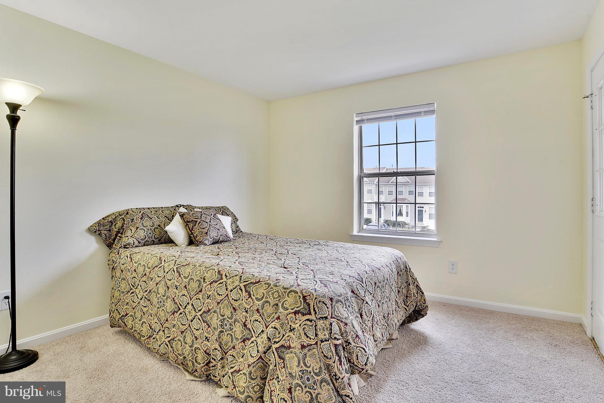 14802 Rydell Road, Unit 202 Centreville, VA 20121 - Photo 17 of 27 a bedroom with a bed and a window