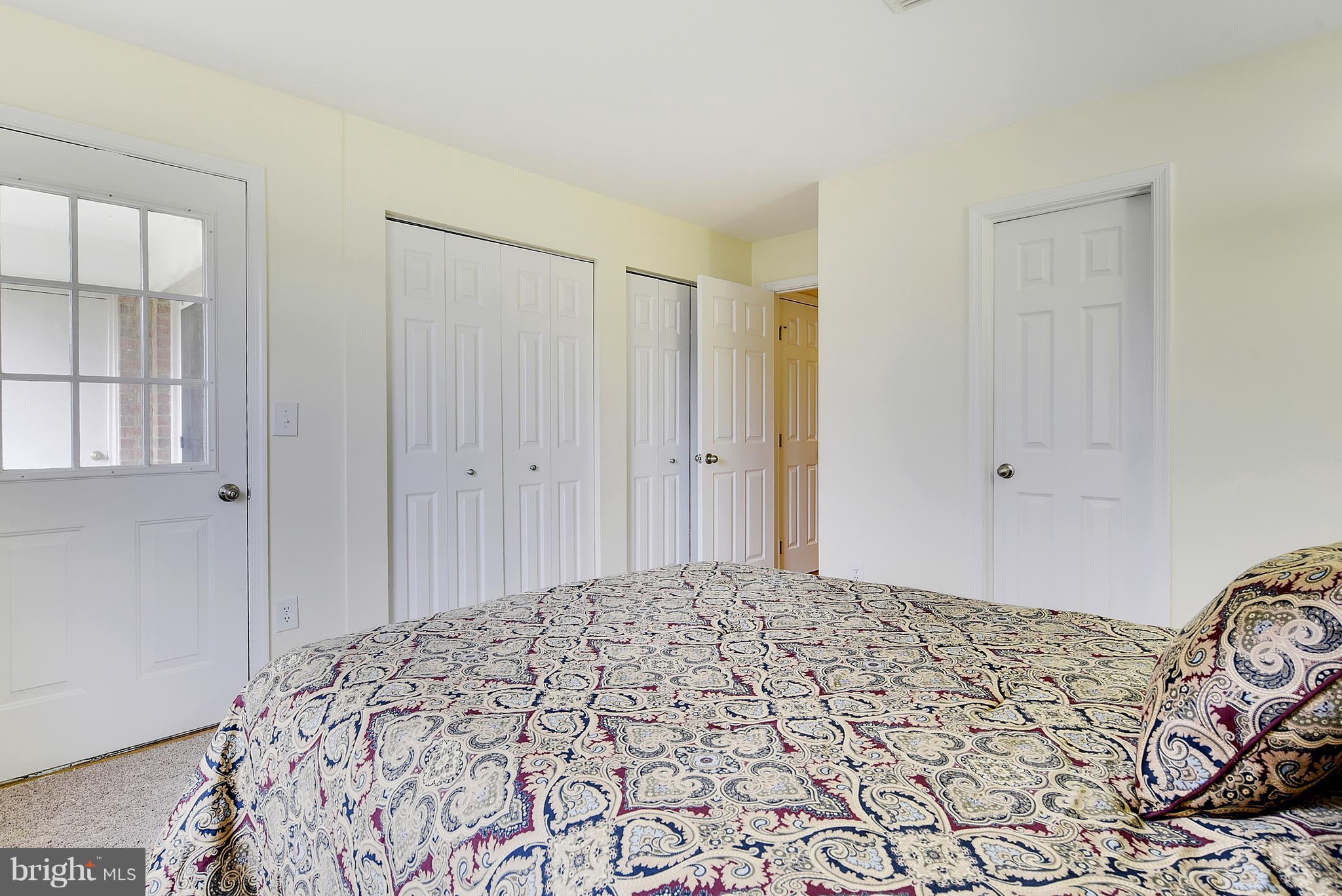 14802 Rydell Road, Unit 202 Centreville, VA 20121 - Photo 18 of 27 a bedroom with a bed and a window