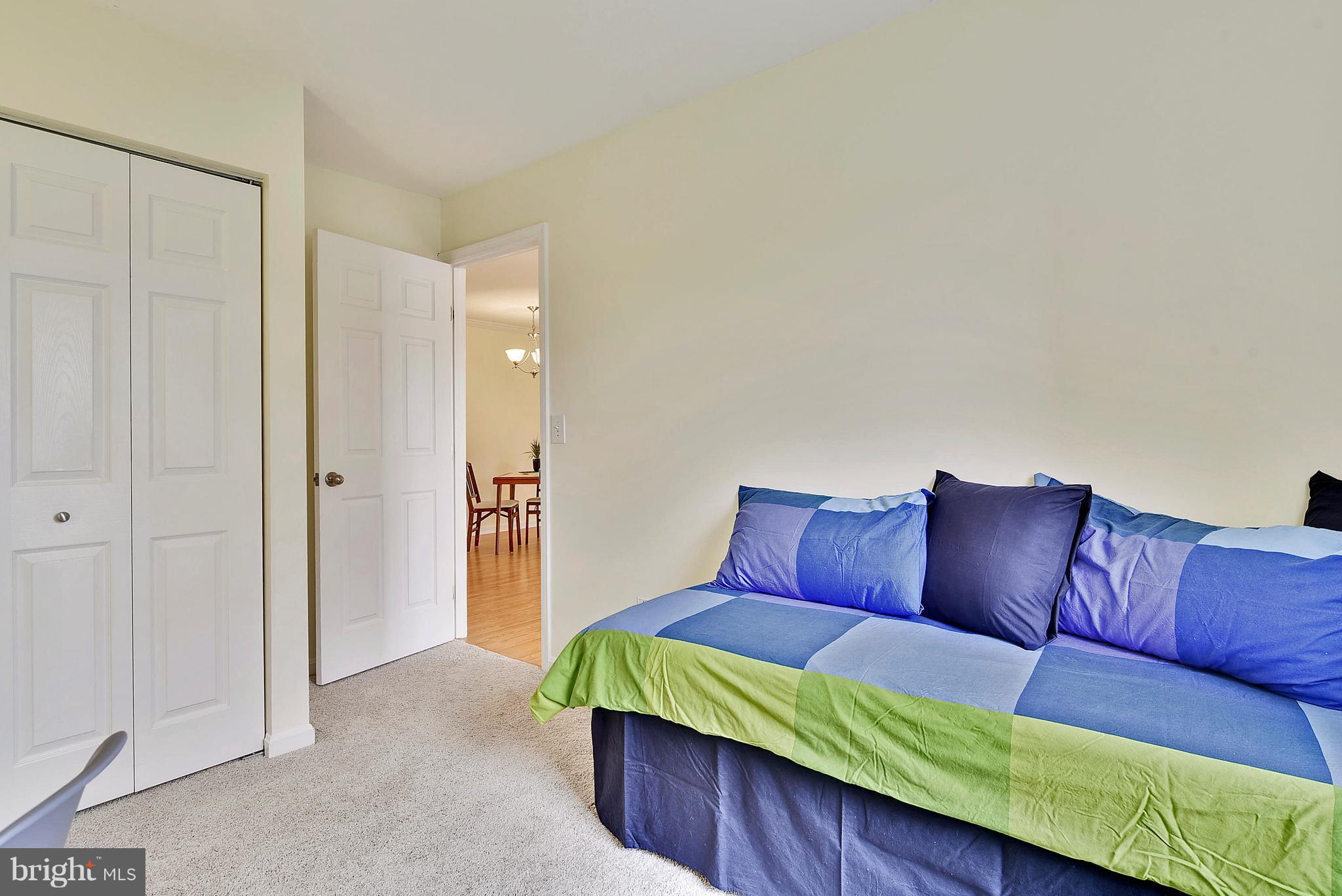 14802 Rydell Road, Unit 202 Centreville, VA 20121 - Photo 22 of 27 a bedroom with a bed and a couch