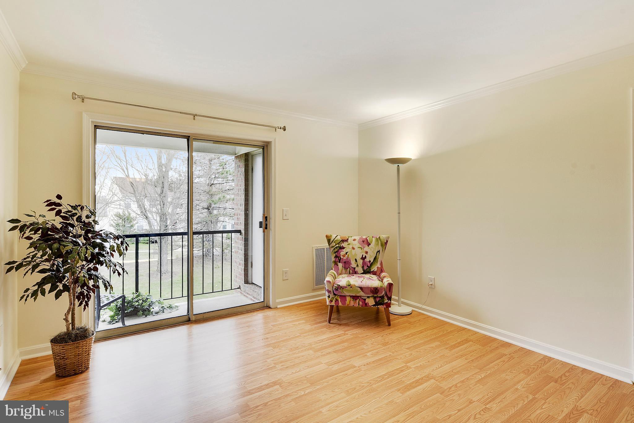 14802 Rydell Road, Unit 202 Centreville, VA 20121 - Photo 6 of 27 a living room with furniture and a large window