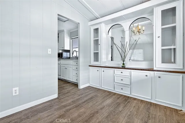 a view of a livingroom with wooden floor