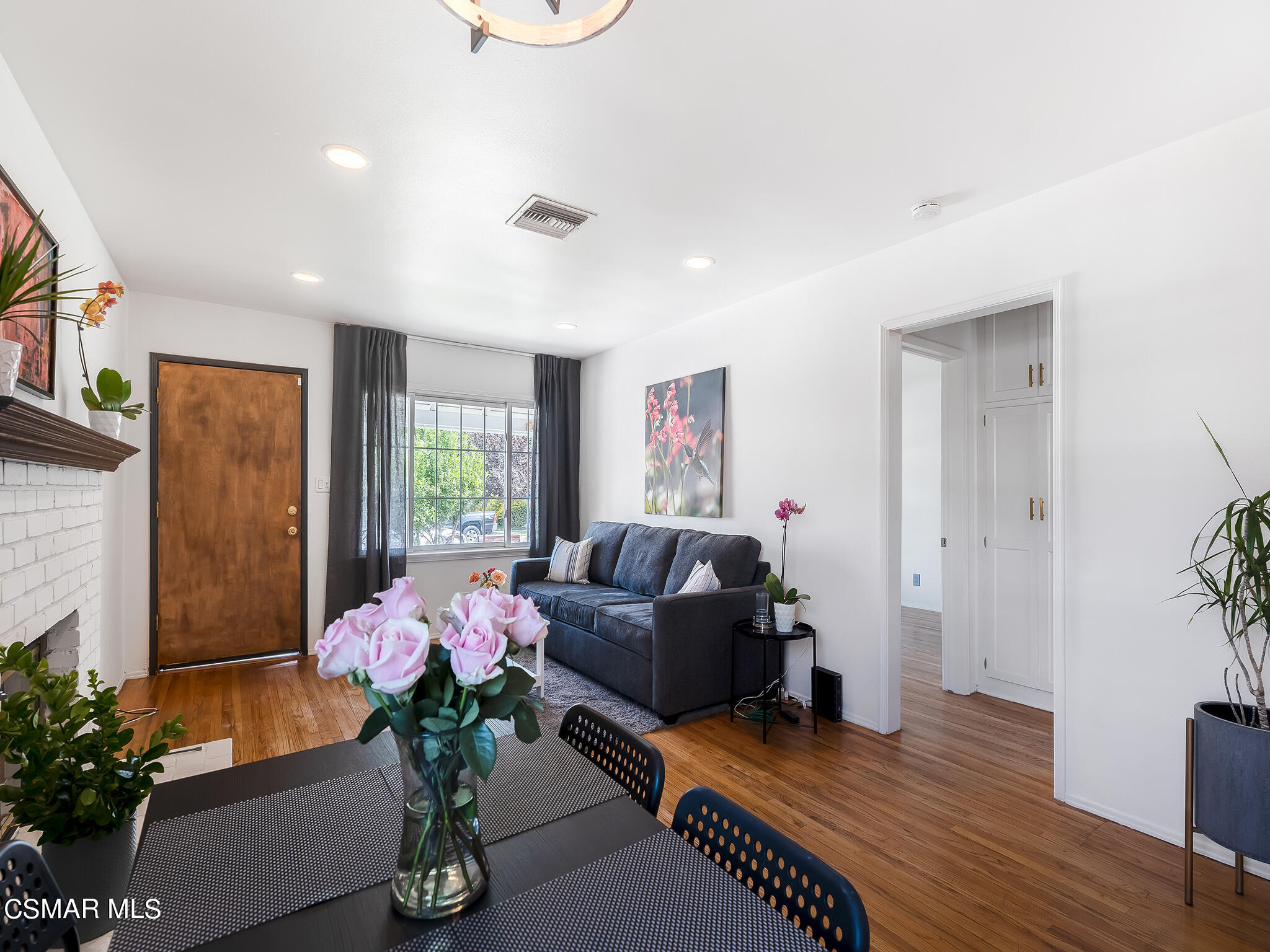 7247 Yolanda Avenue Reseda, CA 91335 - Photo 11 of 33 a living room with furniture potted plant and a window