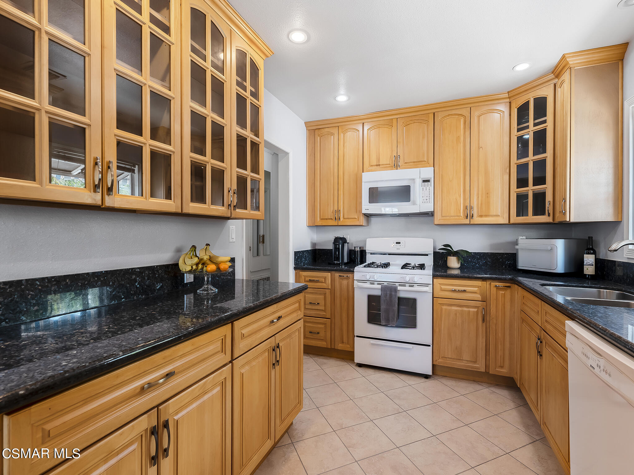 7247 Yolanda Avenue Reseda, CA 91335 - Photo 13 of 33 a kitchen with stainless steel appliances granite countertop a stove and cabinets