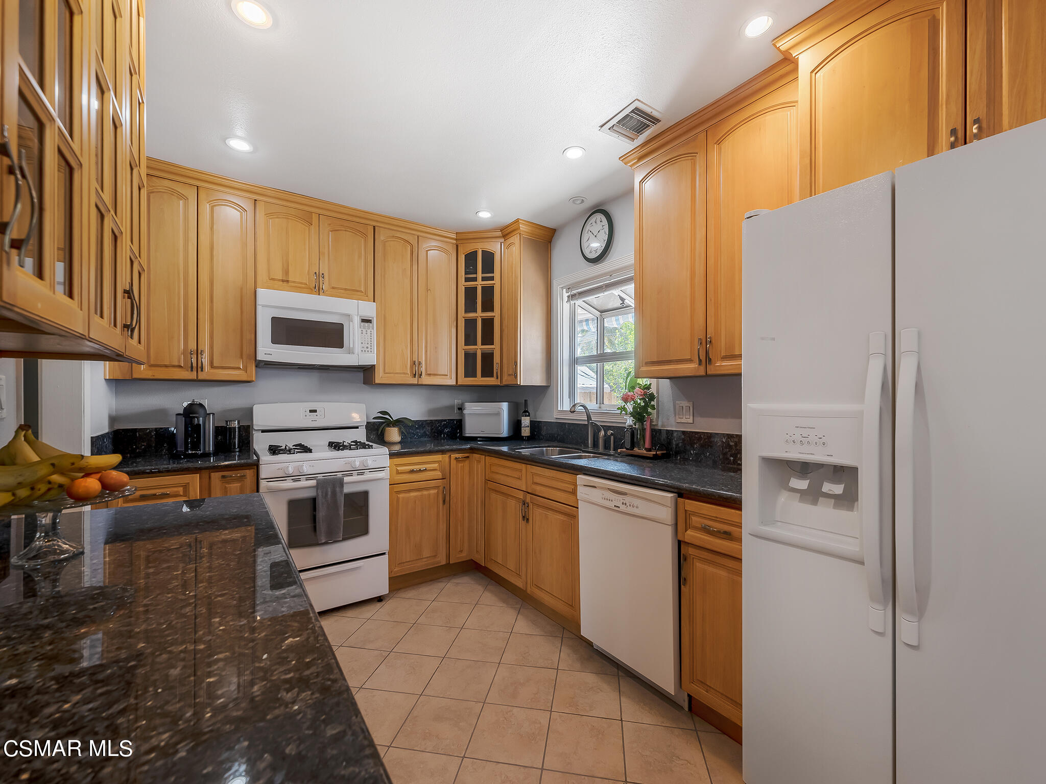 7247 Yolanda Avenue Reseda, CA 91335 - Photo 14 of 33 a kitchen with stainless steel appliances granite countertop a refrigerator sink stove microwave and cabinets