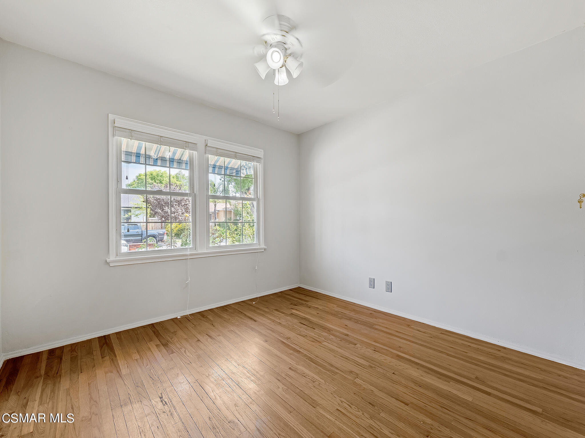 7247 Yolanda Avenue Reseda, CA 91335 - Photo 22 of 33 wooden floor in an empty room with a window