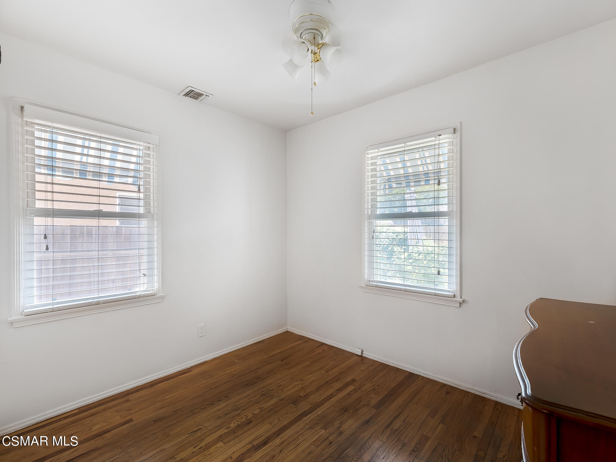 7247 Yolanda Avenue Reseda, CA 91335 - Photo 24 of 33 a view of an empty room with wooden floor and a window