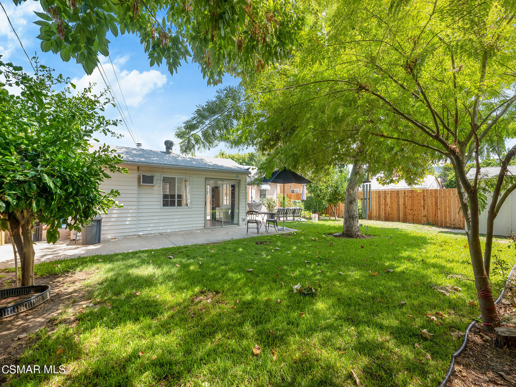 7247 Yolanda Avenue Reseda, CA 91335 - Photo 5 of 33 a view of a house with backyard and a tree