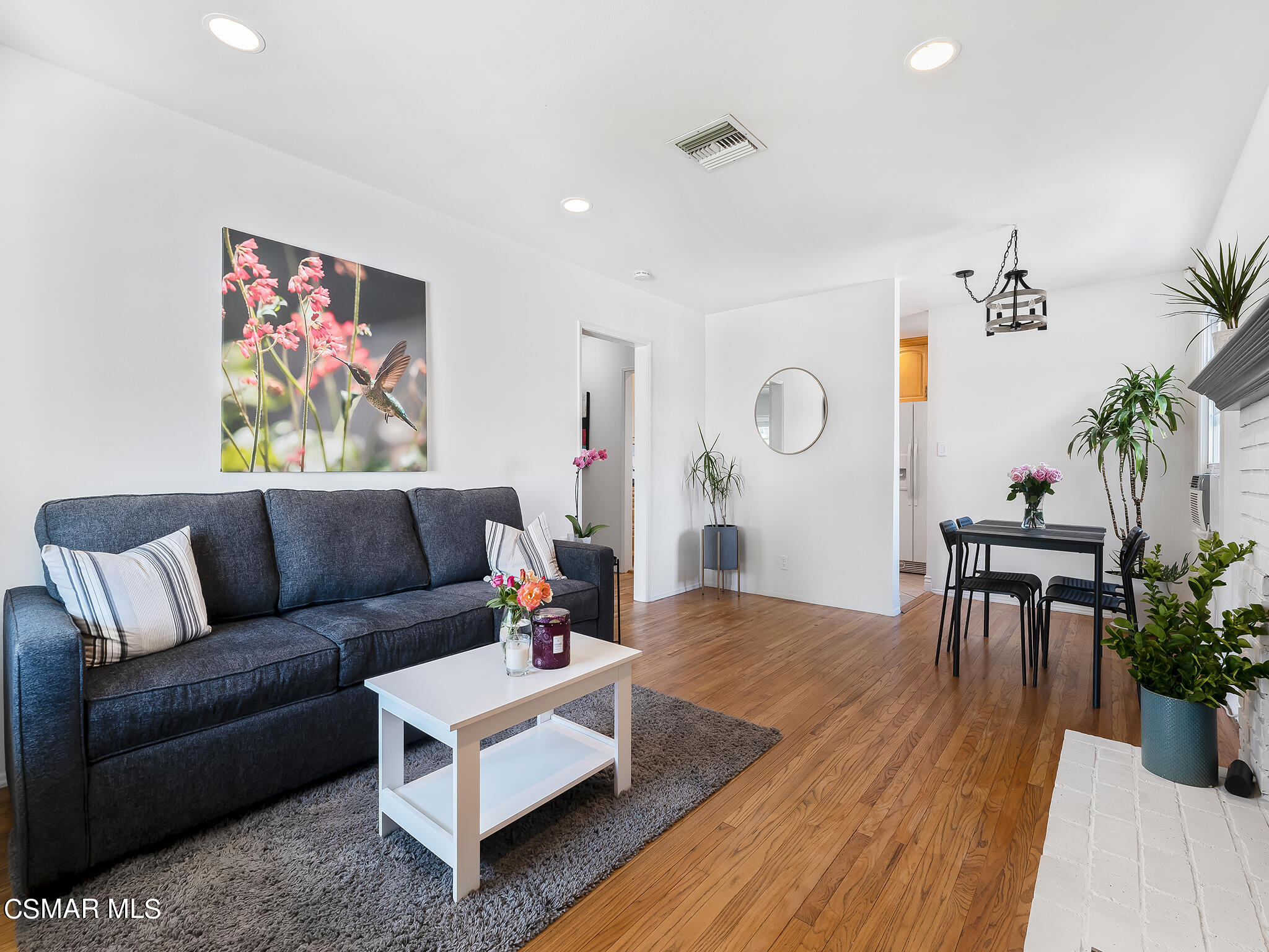 7247 Yolanda Avenue Reseda, CA 91335 - Photo 8 of 33 a living room with furniture potted plant and a table