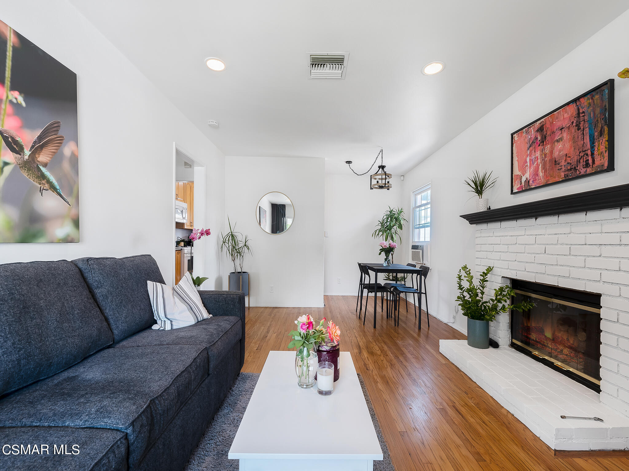 7247 Yolanda Avenue Reseda, CA 91335 - Photo 9 of 33 a living room with furniture and a fireplace