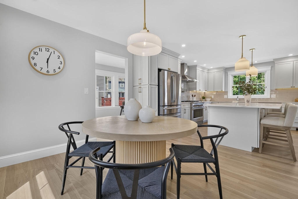 20 Saltonstall Road Medford, MA 02155 - Photo 16 of 41 a view of a dining room with furniture and wooden floor