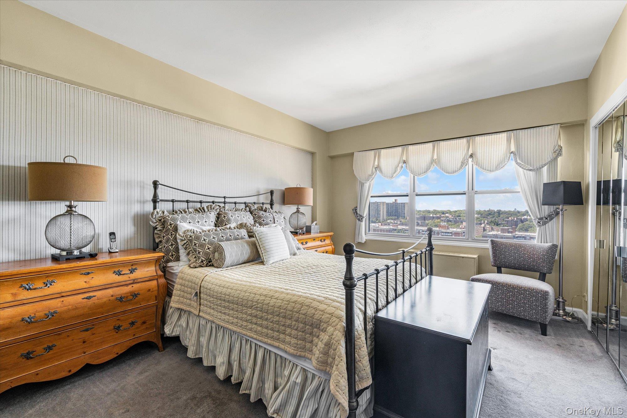 17-85 215th Street, Unit 17E Queens, NY 11360 - Photo 13 of 33 a bedroom with a bed and wooden floor